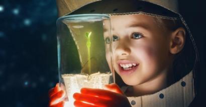 Infant boy engaged with a science experiment activity in an educational setting